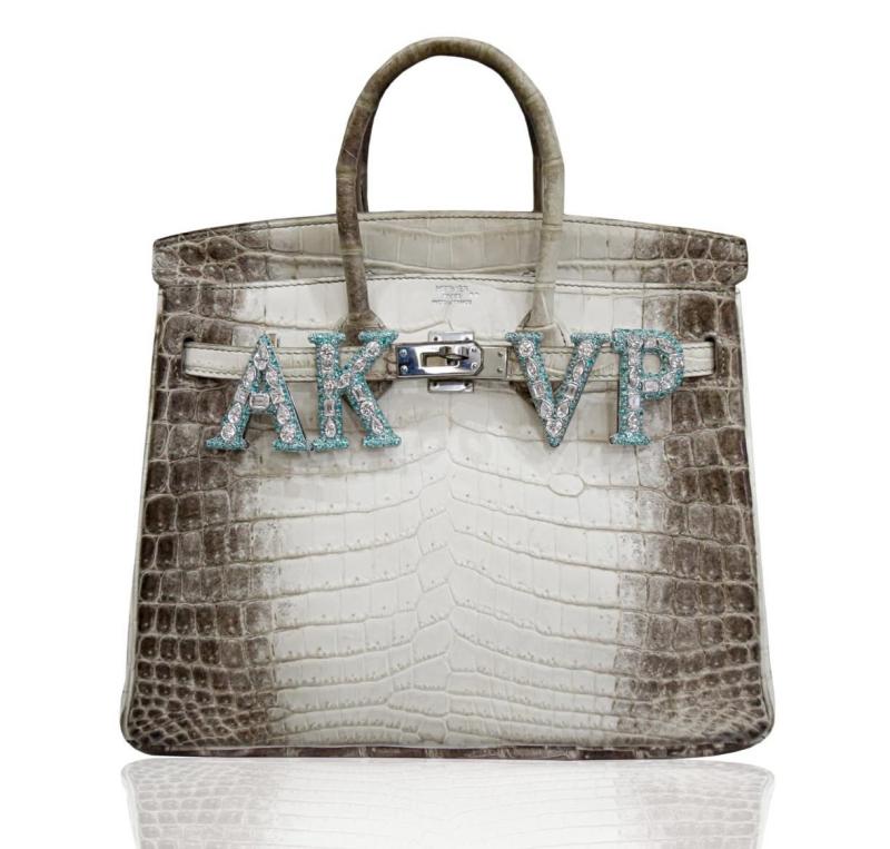 Túi Hermès da cá sấu của người phụ nữ giàu nhất châu Á gắn vật thể lạ- Ảnh 3.